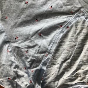 Pale blue with neon ladybug T shirt. Deep V